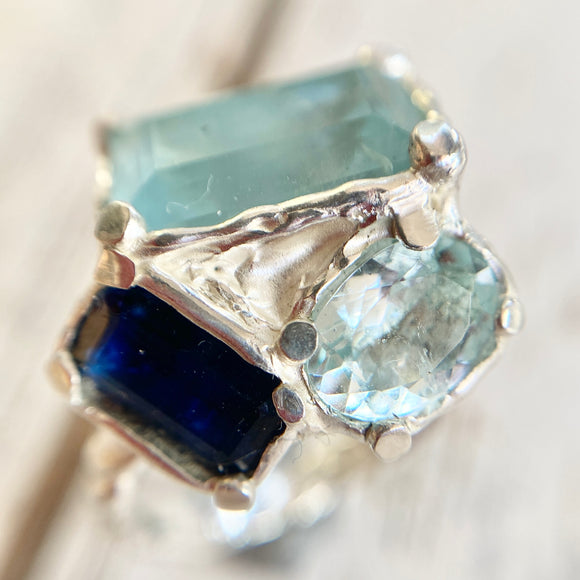 Amazing cocktail ring containing two aquamarines and a kyanite 