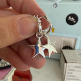 Special interchangeable huggie hoop earrings.