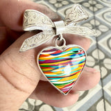 Antique bow brooch with surfite heart